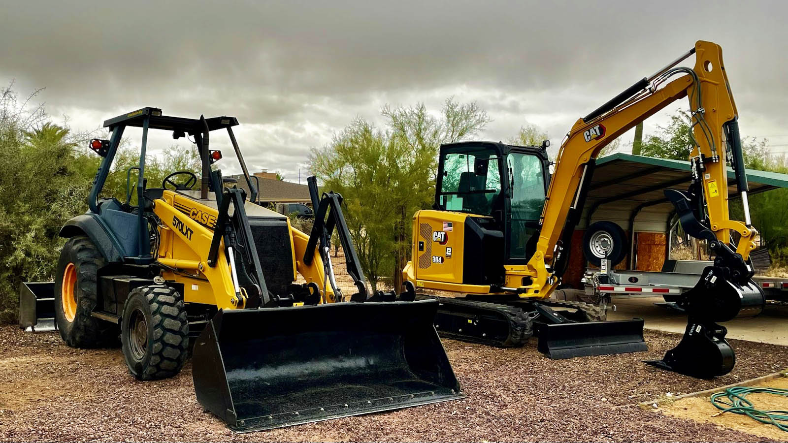 CAT and CASE heavy equipment lined up